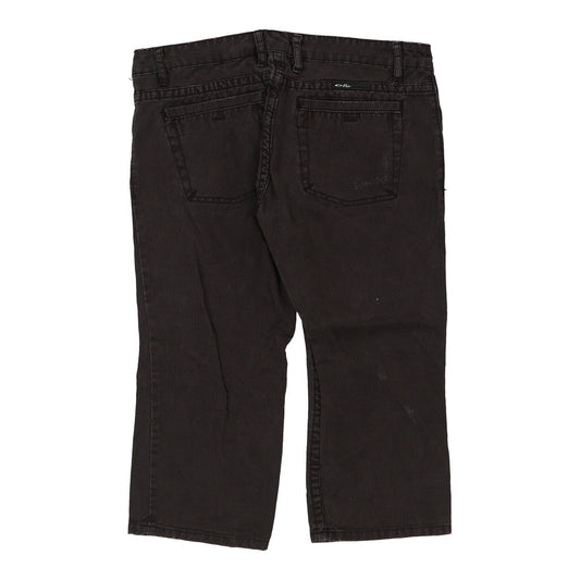 Vintage black Oakley Jeans - mens 32" waist