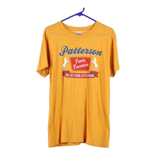  Vintage yellow Patterson Charlie Hustle T-Shirt - mens medium